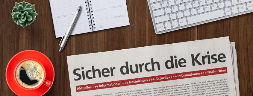 Zeitung mit Schlagzeile Sicher durch die Krise